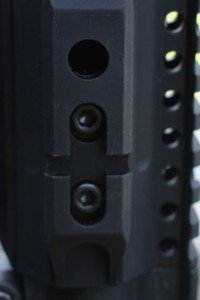 The forend connects to the barrel nut with several hex screws. 