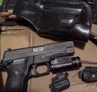 I tried three different rail-mounted lights with the Sig and Galco HALO. All fit just fine.