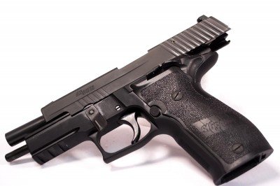 You can keep the safety engaged while manipulating the slide.