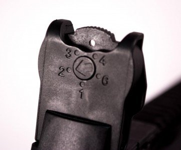 The rear sight has an aperture wheel calibrated for different ranges.