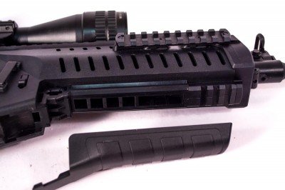 The bottom cover pops off to reveal a proprietary rail for grenade launcher attachment.