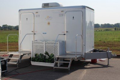 Beretta Breaks Ground in Tennessee Even the porta-john. This thing has its own planter. Beretta still has a ways to go if they want to fit in in the south. We don't air-condition portable toilets, not even for politicians.