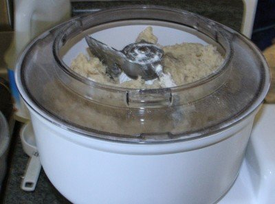 Our test was 5 lbs. of bread flour in one batch. For heavy dough you can lean on the white platform next to the bowl and it works great. 