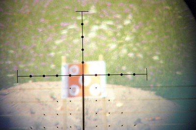 : It was difficult to capture decent photos through the scope. The view was actually much brighter and clearer than it appears here. This shot was included primarily to show you what the un-lit reticle looks like.