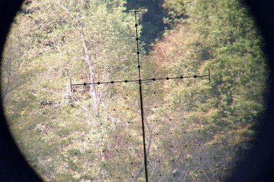 A little better shot through the lens showing where the distance data appears relative to your view through the scope. These shots definitely do not do the image quality justice.