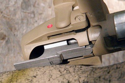 You can see how the hammer is cocked as the bolt handle is lifted.