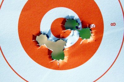 Zeroing shots 9, 10, and 11 on the left. I shot 12 and 13 after cleaning the barrel which caused them to move right and up.