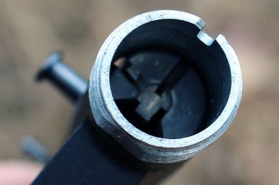 The barrel screws right onto the receiver, and can be tightened by hand. 