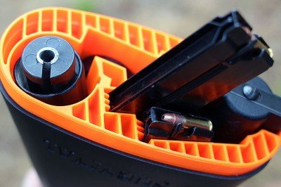 The magazines have channels stamped in that guide them into the gun, and into the stock.