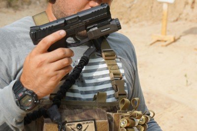 SOE Gear 12ga Micro-Rig AN H&K VP9 fits well, even with a light. A more compact pistol would disappear in the pouch.