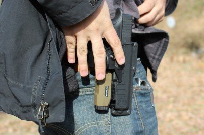 Fobus's Any Light Tactical Holster The snap is cleared with the index finger.