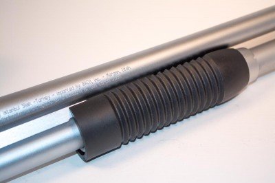 10 Things to Look For In A SHTF Shotgun The forend is matching black plastic with ridges molded for improved grip.