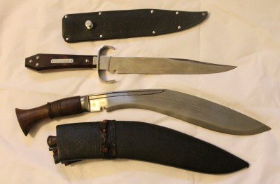 The top one is my Ontario Hell's Belle. I like the belt button sheath, the coffin shaped handle, and the overall weight and balance. 