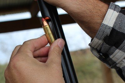 Insert rounds here. The plastic tips of the Hornady bullets help ensure that you won't touch off a primer when the rounds slide down onto the bullet's tip.