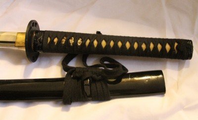 My "good" katana is this Damascus sword that is just like the one in Kill Bill. I love it, but it sticks out when you carry it. 