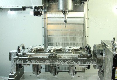 This is the CNC machine just after it opens with 3 finished guns. 