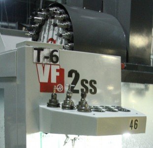 The CNC bits that are used to complete the Model 22 revolve into place on the robot CNC machine. 