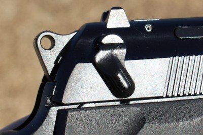 See how close the rear serrations are to the safety? This is why some grouse about the safety's placement.