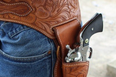 The holster rides in a cut out in the belt. All edges are stitched for extra strength. 