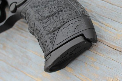 The grip extension on the magazine helps with the full feeling of the grip. 