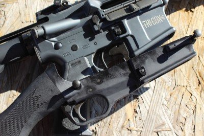 The SCR lower next to an "normal" AR.  Note how much smaller it is.  Also, the location of the trigger and safety. 