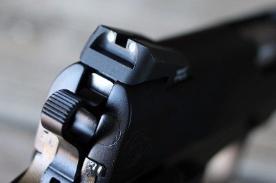 The Trijicon Novack 3-dot sights are solid, but sloped on the back side (which makes one handed operation of the gun unnecessarily complex).