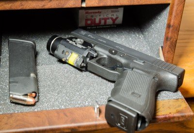 There may be no better bedside friend than the Glock 21. Seen here with a mounted Streamlight TLR-2 and extra ammo, it's ready to defend hearth and home.
