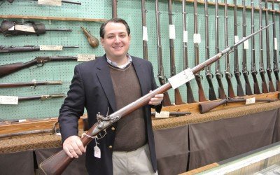 Selling History-Cohen and Sons of New Orleans Barry Cohen holds an 1800 dated Brown Bess.
