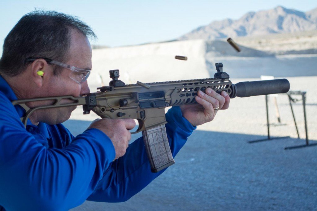 Sig Sauer MCX Black Mamba--SHOT Show 2015 You can't buy happiness, but you can get a good dose shooting a suppressed MCX in full auto.