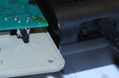 Prepping 101: Perimeter Alarm Security - The Wireless Options A button on both the transmitter and receiver register the two together. You have to do this before you close up the case after putting in the batteries.