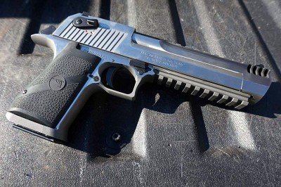 The whole gun comes in over 10 inches, and weighs as much as two 1911s. 