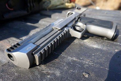 New All Stainless Desert Eagle--Gun Review The fixed barrel allows for more weight to remain forward. If the whole slide moved back, it would be ridiculous.