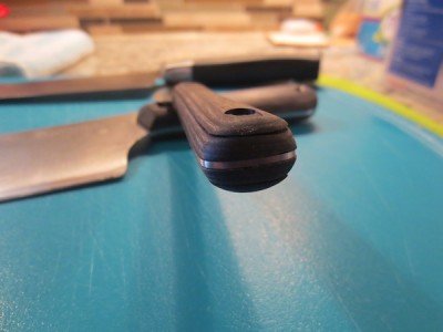 The warped diamond wood handle on the paring knife. Don't put wood in the dishwasher!