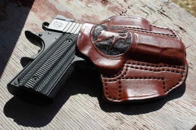 The Nighthawk guns often come with custom holsters. This one has the Nighthawk logo prominently embossed on the front. 