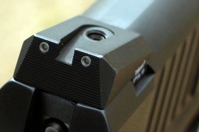 Sloped sights? What's the point? Are they designed to be easier to put back in the holster?