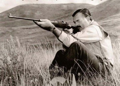 This is a famous picture of Ernest Hemingway that graces the cover of the book "Hemingway's Guns." As an avid African game hunting, Hemingway always used his Springfield with express V notch sights. 