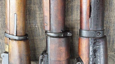 These are three styles of barrel bands on the Mosin-Nagant. The one of the left is most common and comes off easy. 