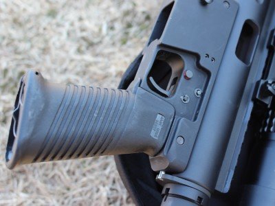 The lower resembles an AR, but the safety is a cross-bolt style. 