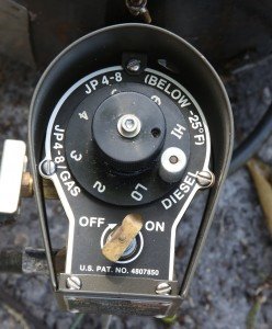 This is the fuel regulator. You set the silver knob to the fuel type, and the dial then corresponds to the heat level. 