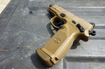 Can the FNX 45 Tactical be adapted for the Modular Trials? The 15 round mags have a fat pad on the bottom that helps protect them from rough mag drops.