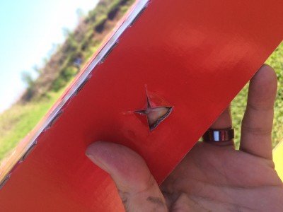 The shelves have holes that make hanging cans easy. 