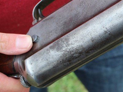 The button is used to lock the bolt open. 