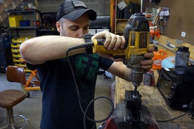 Cordless drills may not cut it. Go for a larger drill, or a drill press. 