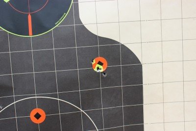As I got more comfortable with the gun, the groups tightened. This is from 25, standing, with both hands in a traditional hand-over-hand grip.