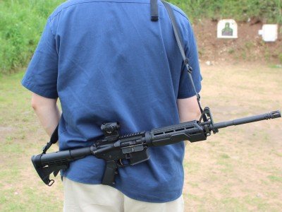 There's enough slack to carry it however you want. This style here is not recommended, but it leaves both hands free 