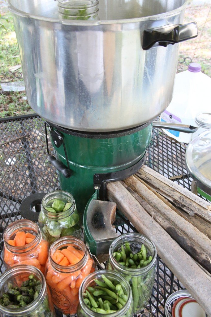 My first shot at canning with my StoveTec Rocket Stove didn't work. As you can see, I didn't attempt to use the heat ring because it didn't fit around the pot, and I stuffed the fuel door with palm fronds, which for normal cooking works great, because you don't want ripfire heat. 