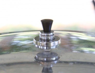 Then replace the weight, listen for the steam escaping, and hold it at temp for the required canning time. You do not have to maintain a ripping hard boil that makes the weight jingle. The directions say nothing about this. 