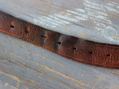 Get Serious about your Belt--Mean Gene Belts with holes mean small adjustments. Here you can see how much my weight has fluctuated over 15 years. A roller buckle will keep the belt from stretching so badly.