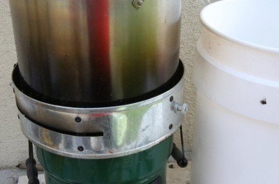 The Rocket Stove makes a mess of the sides and bottoms of pots, but it works. 
