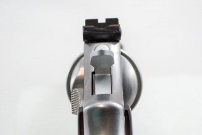 The rear sight is adjustable for windage and elevation. Note the grooves to reduce glare.